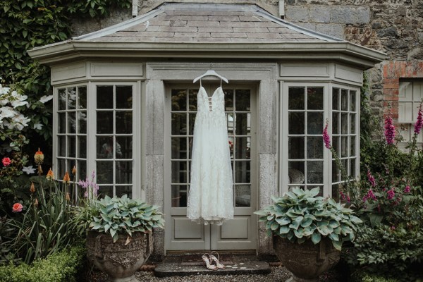 Exterior wedding dress hanging flowers