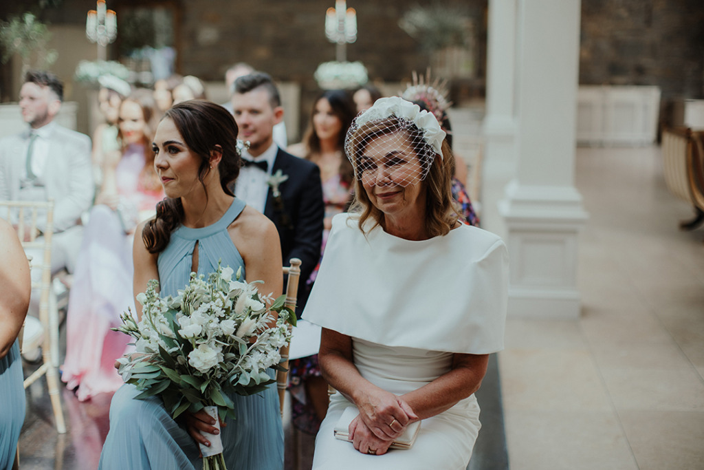 Close-up mother bridesmaid guests friends family ceremony