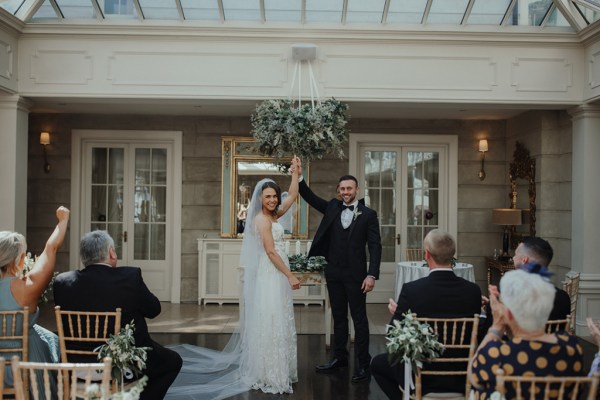 Bride groom ceremony clapping holding hands