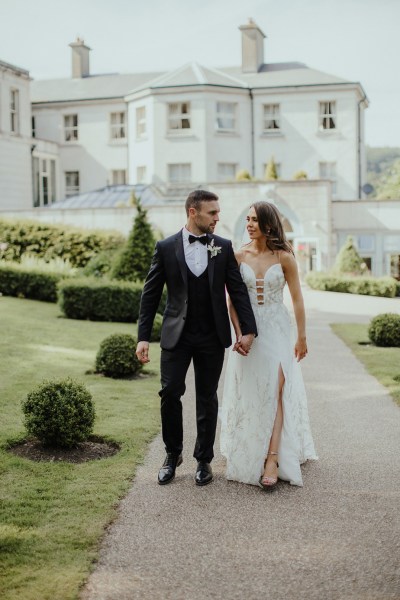 Holding hands exterior couple just wed happy garden