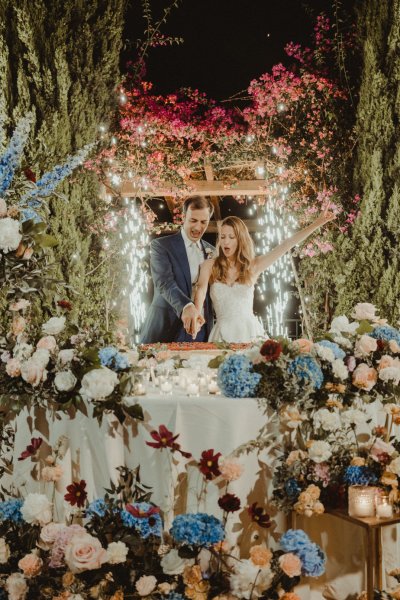 bride and groom with cake