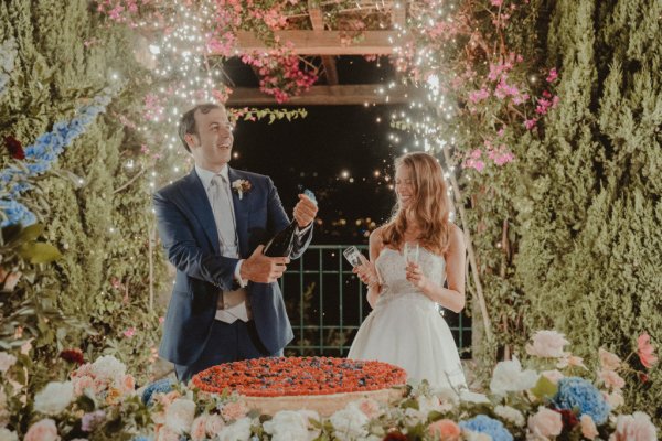 bride and groom with cake