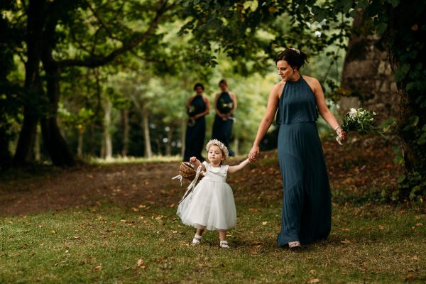 bridesmaid and flower girl walking