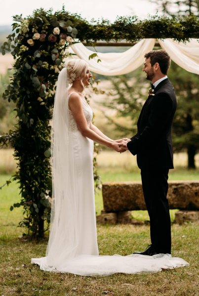 bride and groom wedding ceremony outdoors