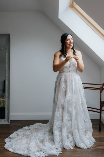 Bride in lace wedding dress getting ready Olga Hogan Photography: Hannah & Eoghan