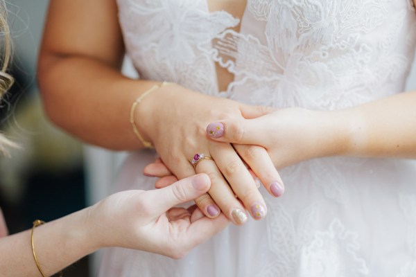 Bride showing off engagement rign with pink stone or gemstone with manicure and nail art Olga Hogan Photography: Hannah & Eoghan