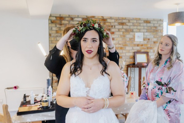 Floral head piece is fixed on bride Olga Hogan Photography: Hannah & Eoghan