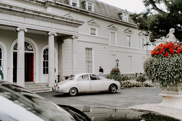 Exterior wedding car white just married flowers manor hotel