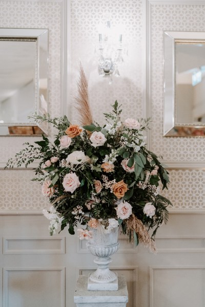 Orange pink and white roses flowers eucalyptus elegant interior