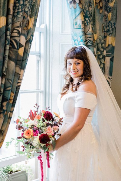 bride with bridal bouquet colourful pink and purple