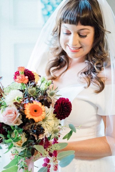 bride with bridal bouquet colourful pink and purple