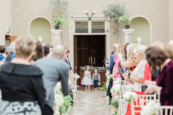 flower girl and page boy walking up the aisle