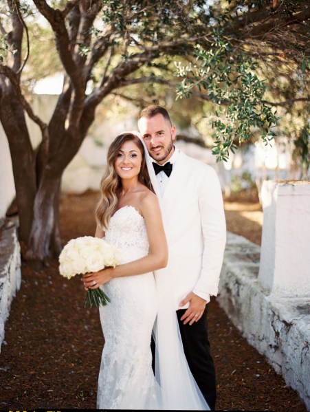 Interior bride and groom embrace ceremony bouquet of flowers exterior