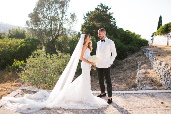 Bride groom in Greece exterior bouquet of flowers