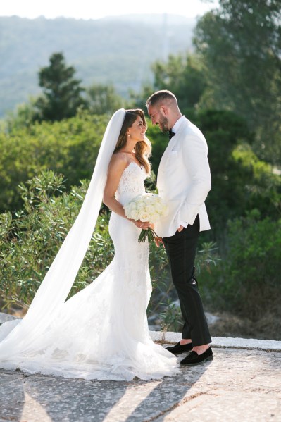 Bride and groom train exterior sunshine sunny dress detail flower bouquet