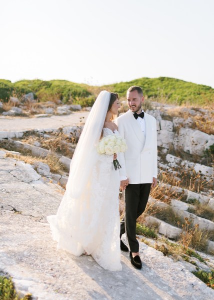 Bride and groom sea beach mountain cliff bouquet white dress suit