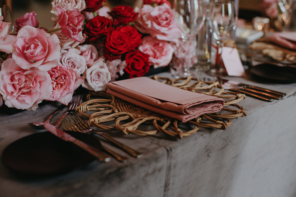 table decor reception room flowers and candles pink and red