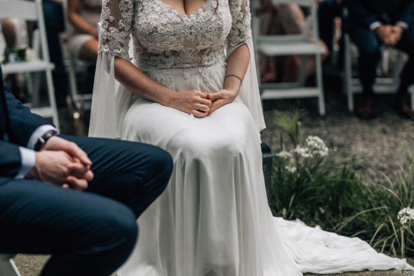 Bride and groom close up legs sitting