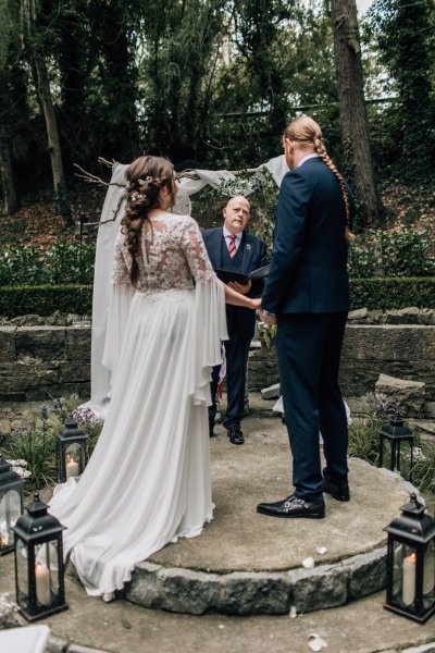 Bride groom officiant officiate at alter wedding ceremony