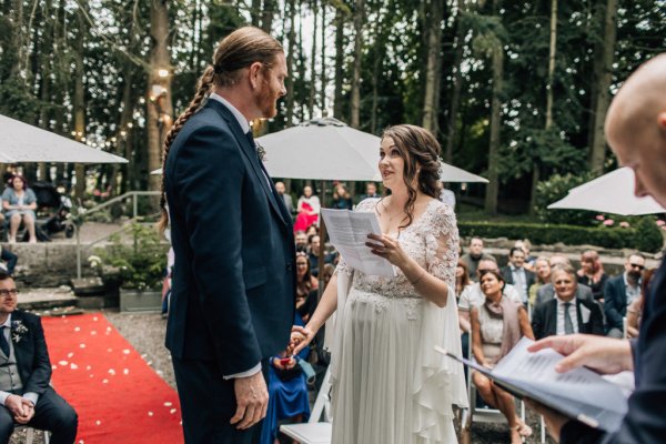 Bride and groom reading their I Dos speech ceremony