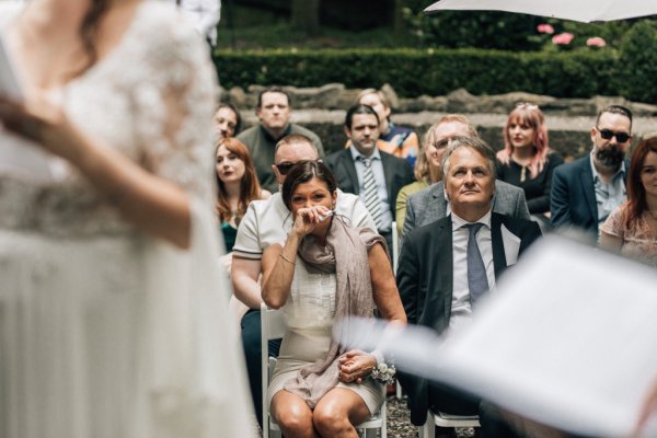 Bride and groom reading their I Dos speech ceremony crying audience