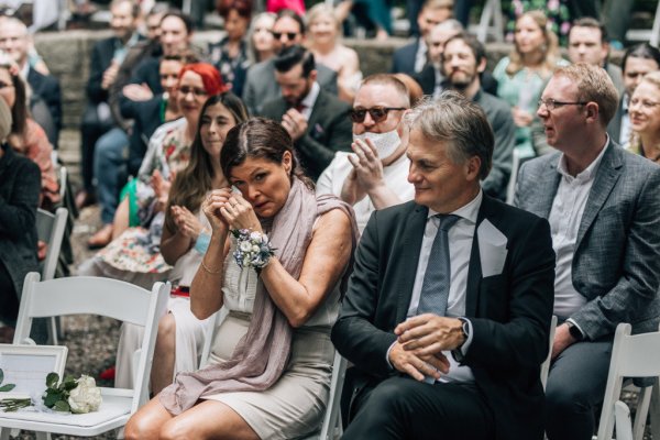 Crying audience guests at wedding ceremony