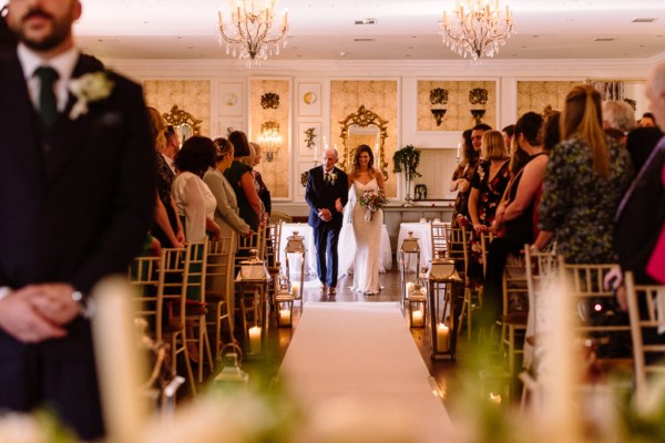 bride walks up the aisle at Castle Durrow