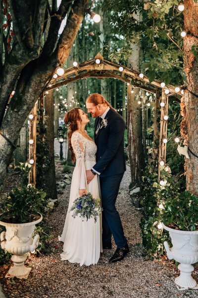 Bride and groom lights plants flowers bouquet