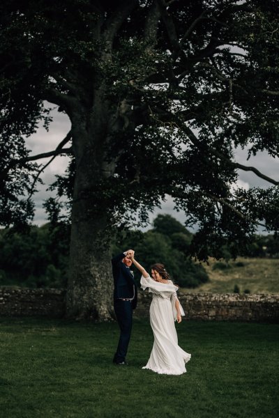 Couple dancing bride groom exterior forest green