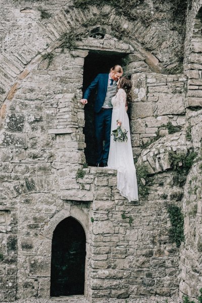 Bride and groom window brick castle exterior