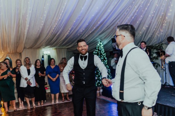 groom and groom mr and mr in tuxedos