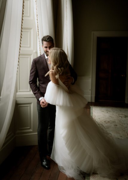 Bride and groom interior window curtains