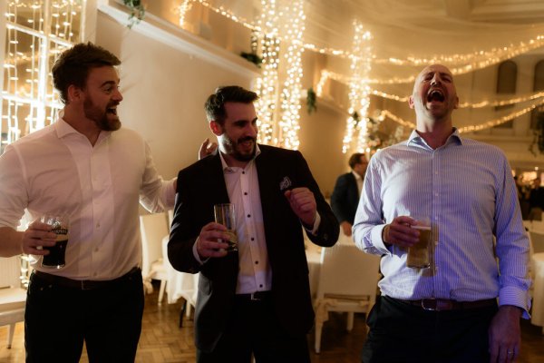 Groom dancing guests