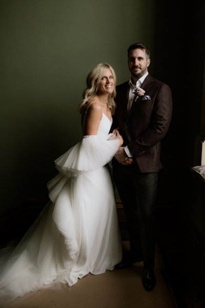 Bride and groom pose smile