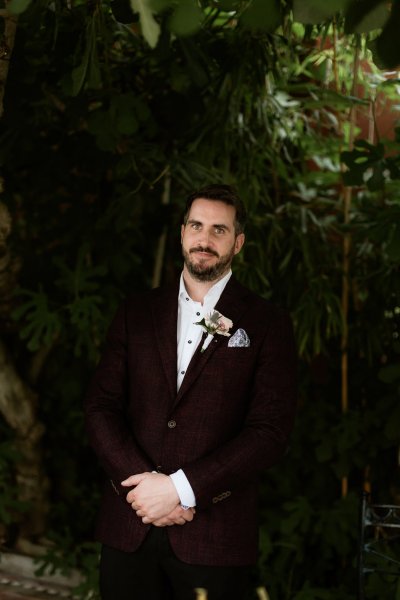 Groom black suit on his own