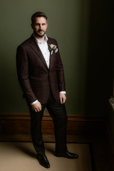 Groom on his own suit flower