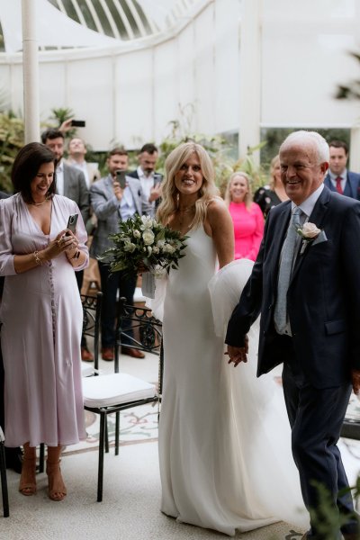 Bride groom smiling father mother family