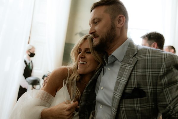 Bride and groom embrace