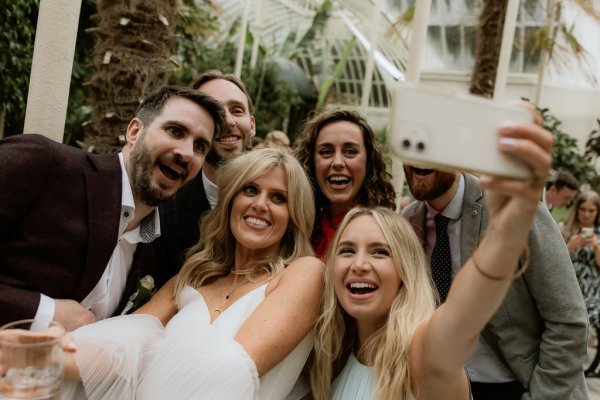 Bride and friends guests laughing