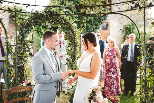 bride and groom couple exchange rings