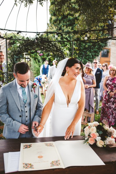 bride and groom couple sign registery