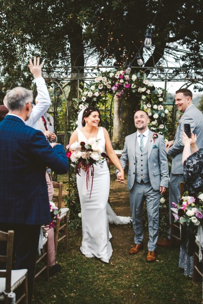 bride and groom couple showered with confetti