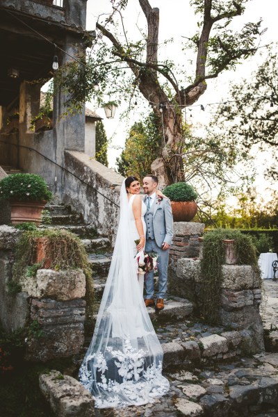 bride with cathedral veil and groom at destination wedding