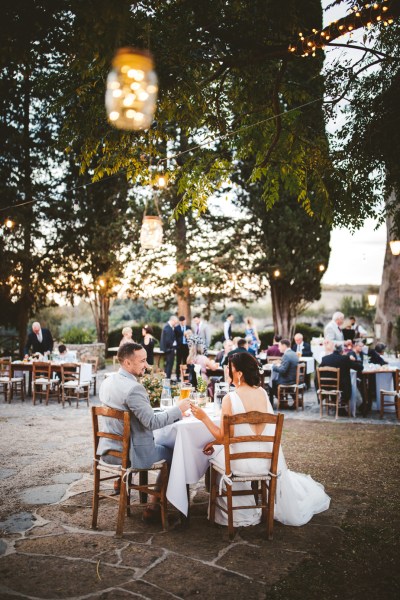 bride and groom couple at sweetheart table at reception at destination wedding