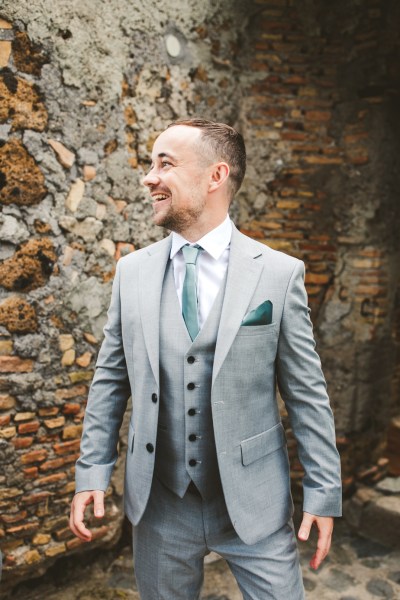 groom in grey suit