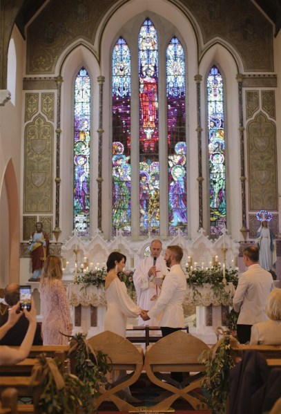 bride and groom in church saying vows