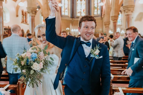 bride and groom exciting ceremony