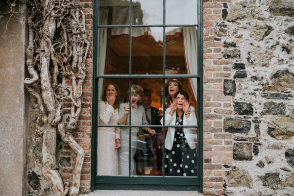 guests looking out window