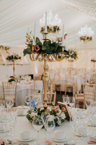 gold candelabra with flowers table centerpiece