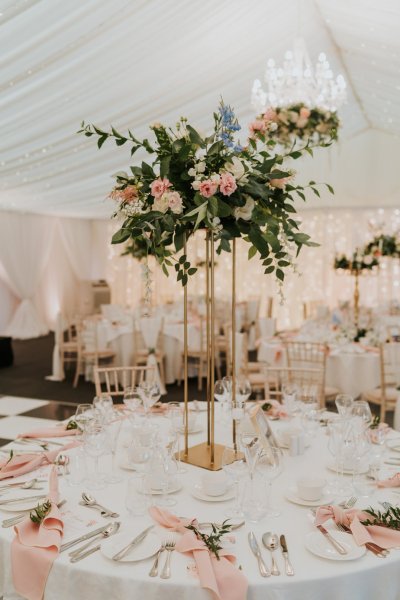 gold geo stand with flowers table centerpiece